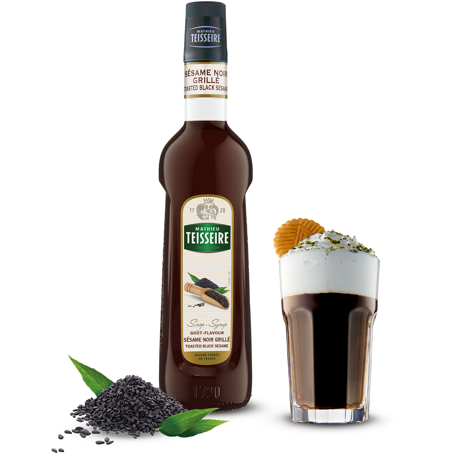 Bottle of Teisseire syrup with a shot glass filled with the syrup on a white background