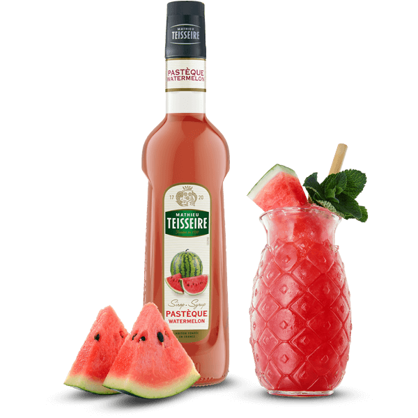 Bottle of Teisseire watermelon syrup with a cocktail and watermelon slices on a black background