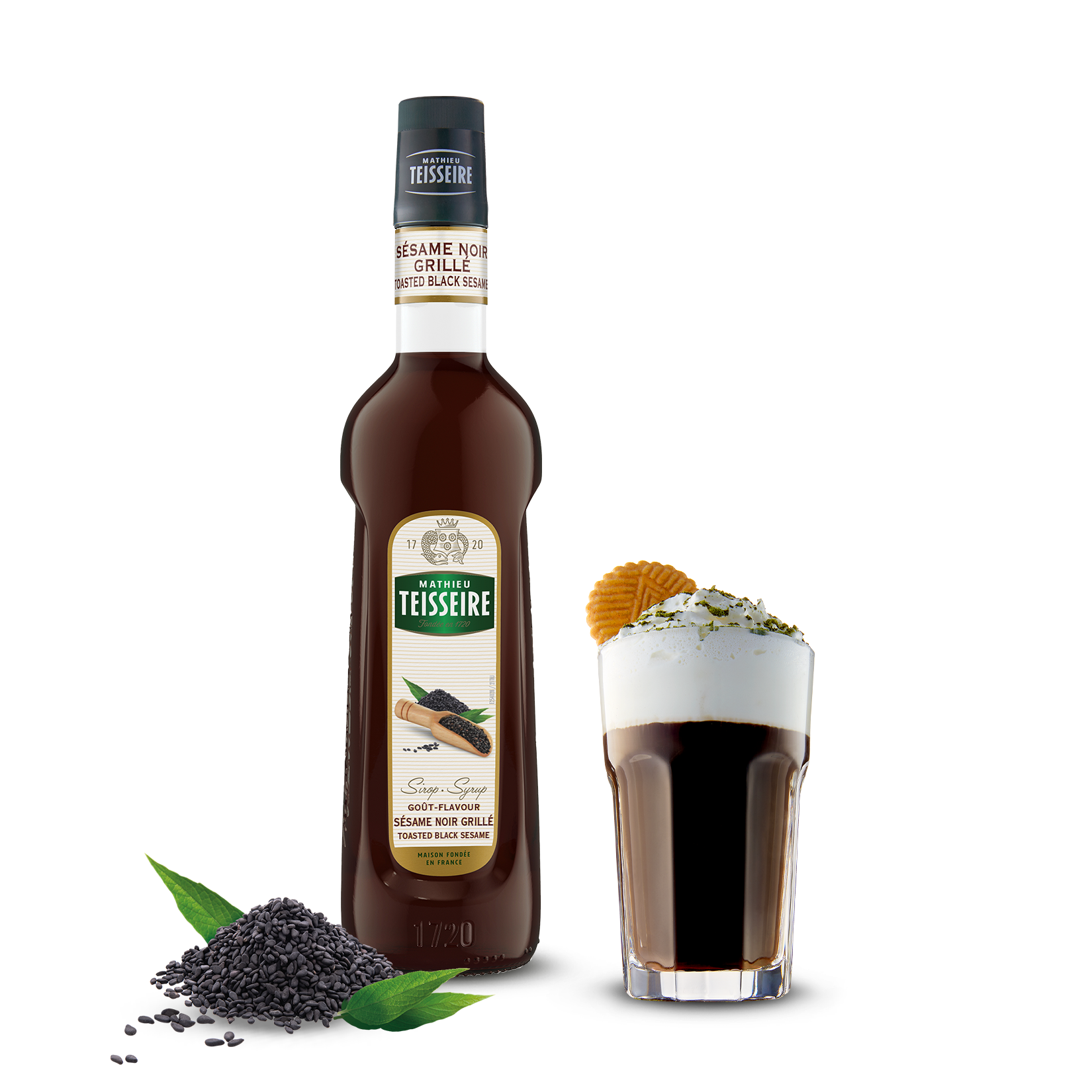 Bottle of Teisseire syrup with a shot glass filled with the syrup on a white background