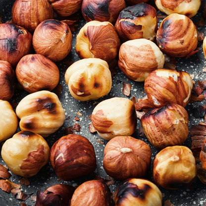 Roasted chestnuts on a dark surface