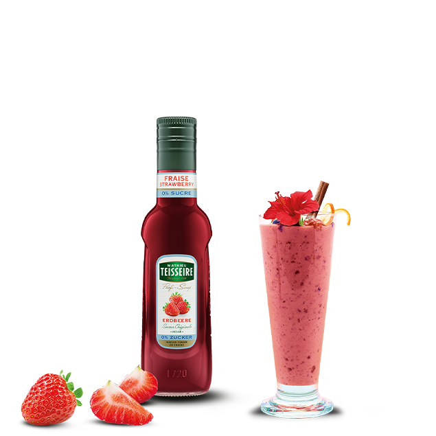 Teisseire strawberry syrup bottle with a strawberry milkshake and strawberries on a white background