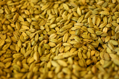 Close-up of a pile of green cardamom seeds.